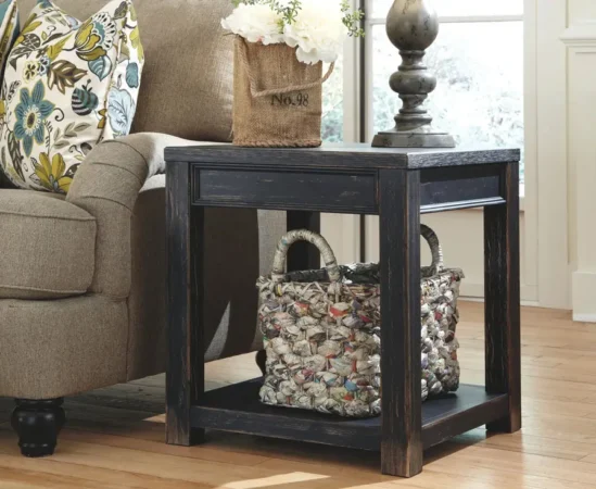 Rustic end table with flowers beside sofa.
