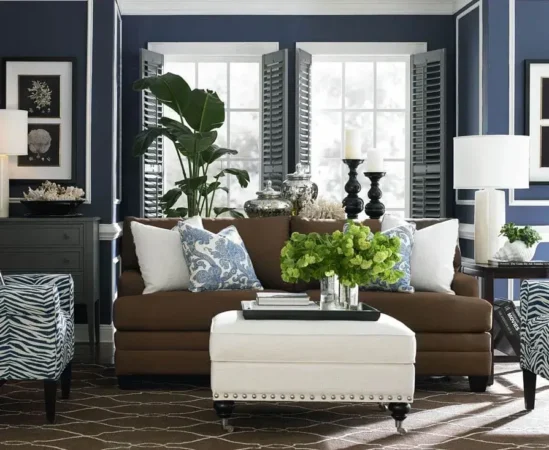 Stylish living room with blue walls and brown sofa.